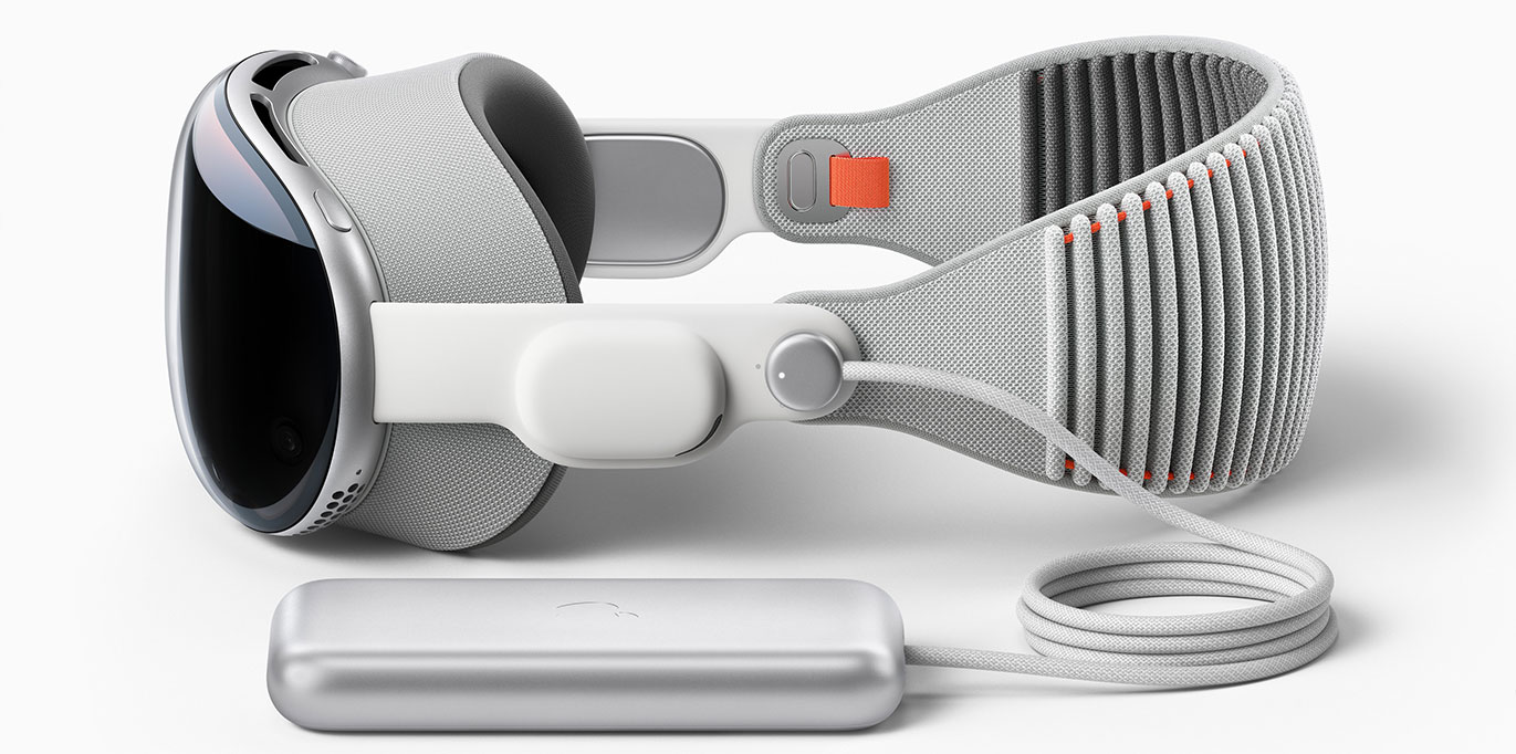 Apple Vision Pro headset in profile view, battery attached.
